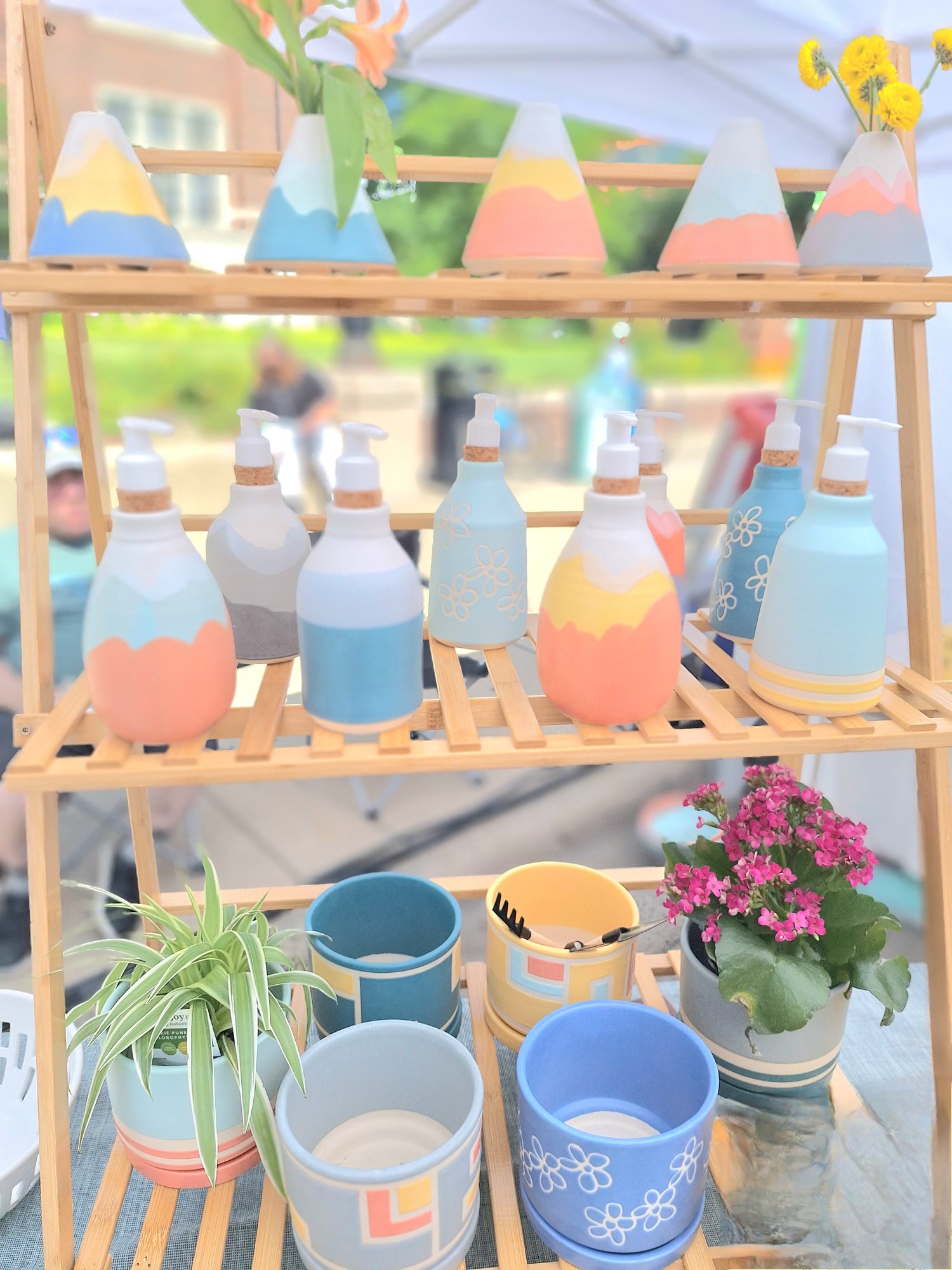 handmade ceramic vases, soap dispensers, and planers